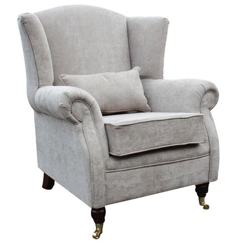 This wingback chair features a high back, tapered legs, square arms and nailhead trim in chrome. Wing Chair Fireside High Back Armchair Velluto Hessian ...