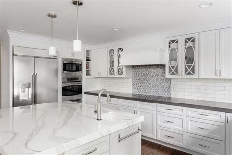 Light Grey Kitchen Cabinets With White Marble Countertops - Quartz Countertops