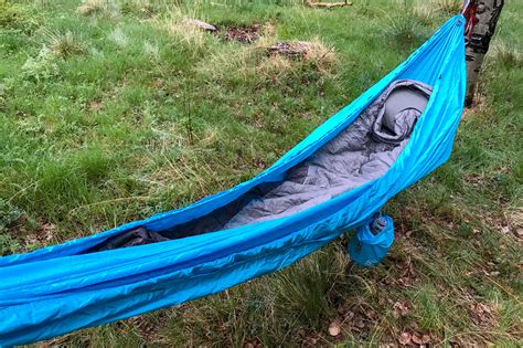 For those that don't know, a hammock top quilt is built like a sleeping bag but without the top hood and back, it does however retain the foot box. Tents vs. Hammocks: How a Traditional Camper Took to Sleeping in Trees | GearJunkie