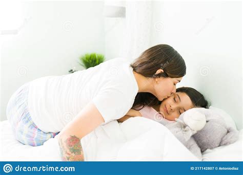 Affectionate Mother Tucking Her Kid In Bed Stock Image Image Of