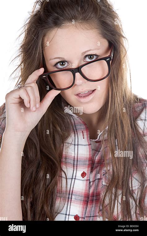 Shot Of An Attractive Brunette Geek Holding Her Glasses Stock Photo Alamy