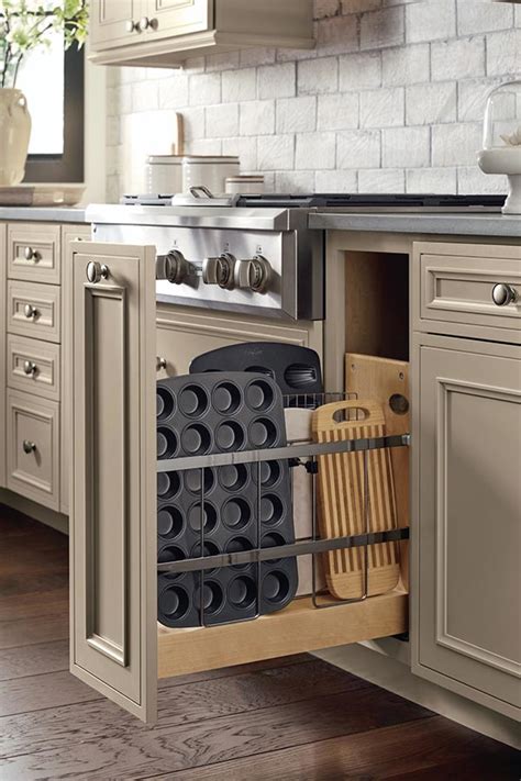 I'm noticing a design trend of differentiating between cabinet doors and drawers with pulls and knobs. Taupe Kitchen Cabinets - Decora Cabinetry
