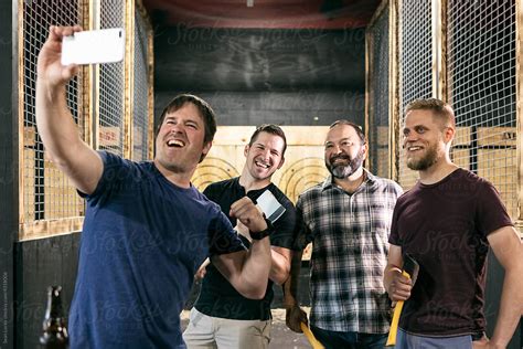 Axe Throwing Guys Get A Selfie Photo Together By Stocksy Contributor Sean Locke Stocksy