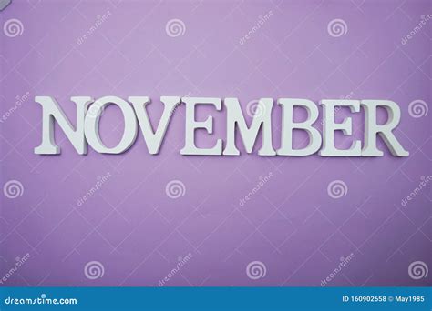 November Alphabet Letter With Space Copy On Purple Background Stock