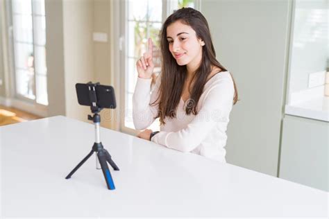 Beautiful Young Woman Recording Selfie Video With Smartphone Webcam