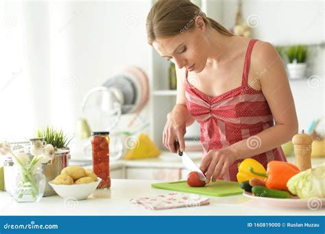 Portrait Of Young Woman Cooking In Kitchen Stock Photo Image Of Adult