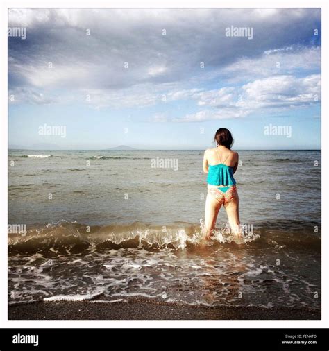 Woman Standing On Beach Rear View Cut Out Stock Images Pictures Alamy