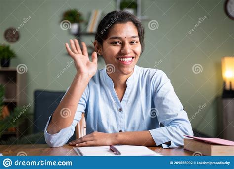 Young Business Woman Saying Hai Gesture Or Waving Hands To Camera