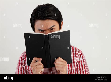 Studio Shot Of Man Holding Open Book Stock Photo Alamy