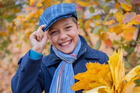 Portrait Of Beautiful Child Boy In The Autumn Nature Stock Photo