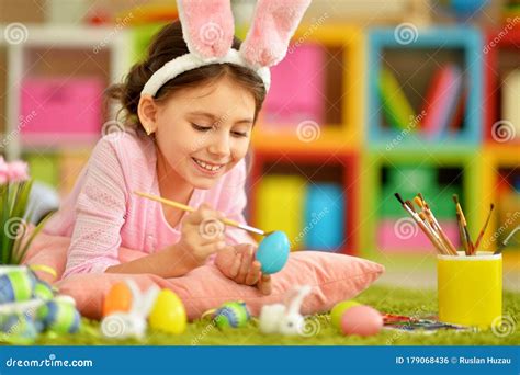 Portrait Of Girl Painting Eggs For Easter Holiday Stock Photo Image