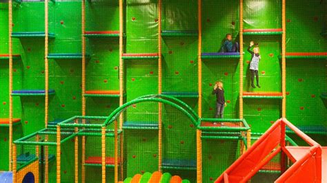 Climbing The Wall At Busfabriken Lekland Indoor Play Center Playground
