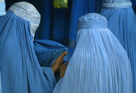 Afghan Women Purchase Burqas Photograph By Kamal Kishore Fine Art America