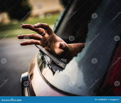 Hand Reaching Through A Broken Car Window For Help Stock Image Image