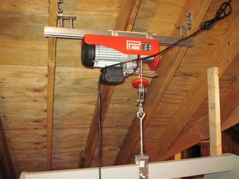 These types of garage storage systems make your home more functional and easier to manage. Attic Lift Hoist | Hoist automatically shuts off if the lift… | Flickr - Photo Sharing!