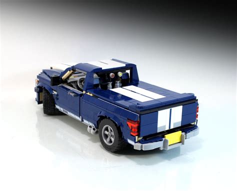 A Toy Truck Is Shown On A White Surface