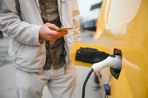 Man Charging His Electric Car Stock Image Image Of Automobile