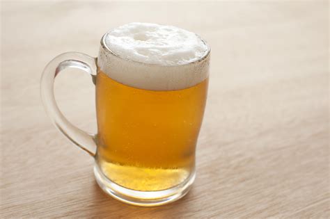 Large Cold Tankard Of Frothy Beer Free Stock Image