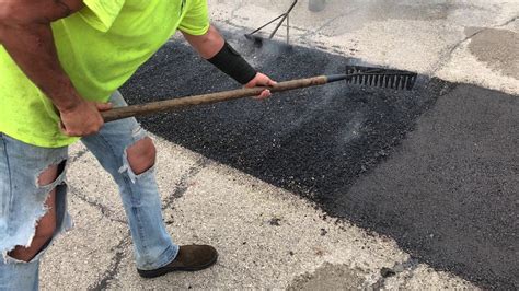 raking asphalt during the infrared repair process youtube