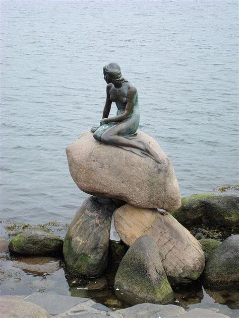 The Famous Little Mermaid Statue In Copenhagen Harbor