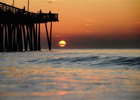 A Sunrise At The Virginia Beach Fishing Pier Photograph By Kevin Romm