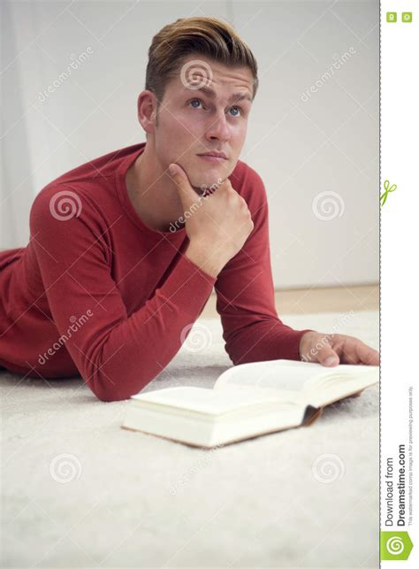 Blond Man Reading A Book On The Floor Stock Photo Image Of Handsome