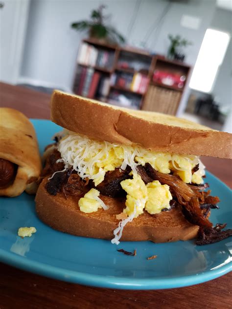 Pulled Pork Scrambled Eggs And Shredded White Cheddar On Toast R