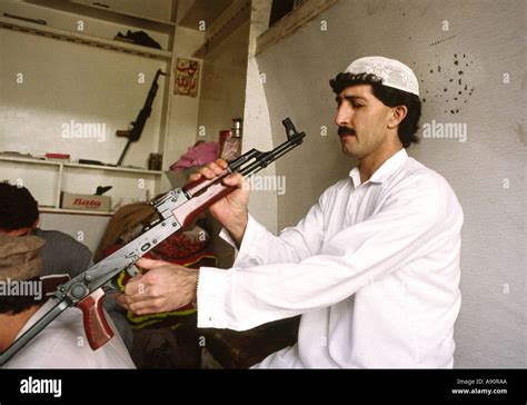 Pakistan Nwfp Darra Adam Khel Man Inspecting Copy Of Ak47 Kalashnikov