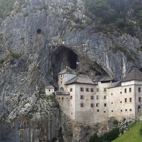 Predjama Castle A Castle In Slovenia Built Into The Side Of A Mountain