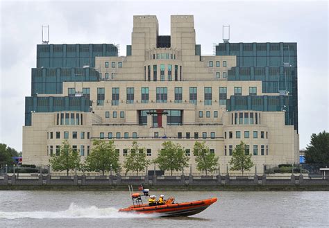 uk s mi6 boss says putin under pressure invites russians to spy for britain reuters