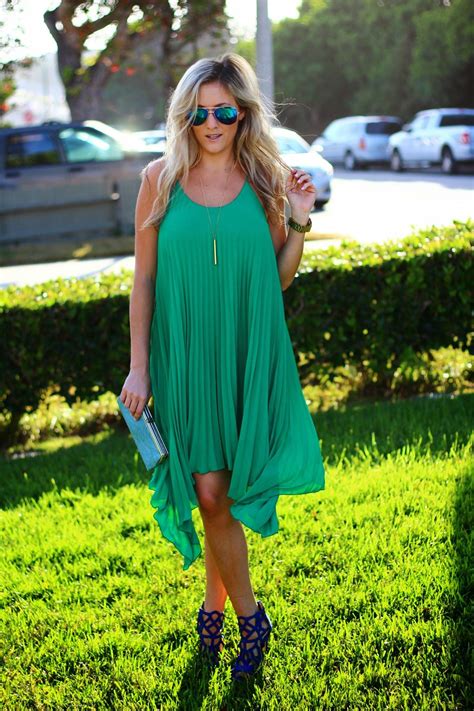 The colors of fall are a beautiful backdrop for an outdoor wedding. Wedding Guest Attire: Pleated Green Dress | Outdoor ...