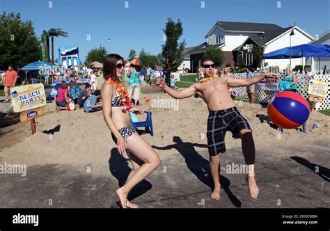 Alexandra Gowdy-Jaehnig, left, and Victor Stepanov dance and play beach
