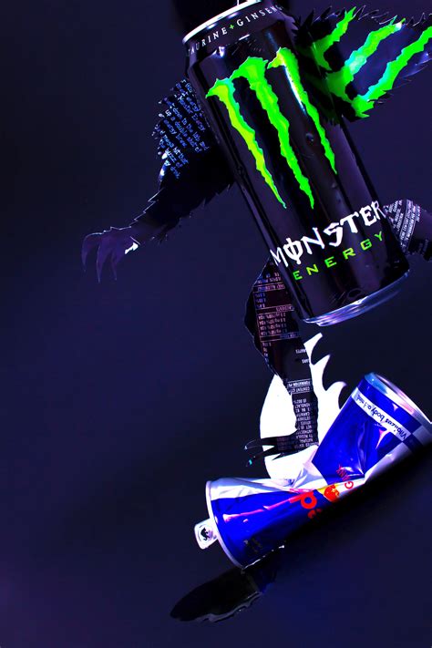 The Monster Energy Drink Is On Top Of A Can