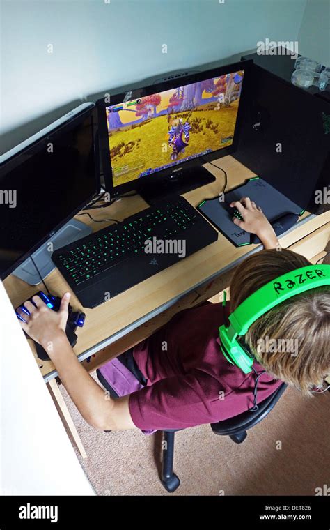 Teenage Boy Playing Computer Games Stock Photo Alamy
