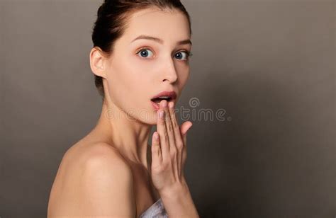 An Image Of A Beautiful Surprised Brown Haired Woman With No Clothes
