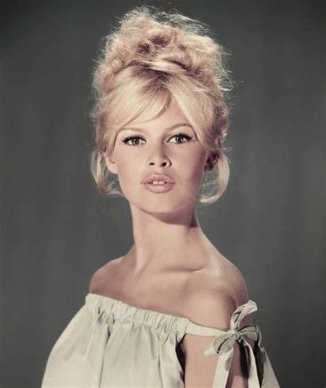 Brigitte Bardot Poses With Her Hair Up In An Elegant Studio Portait