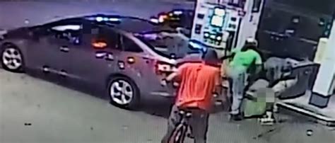 Police Release Video Of Four People Wrestling Victim To Ground At Gas