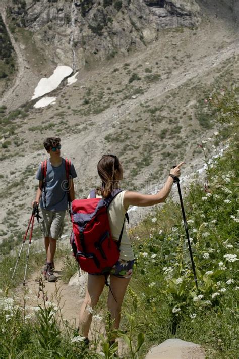 Val D Aosta Italy July 5 2018 Two Hikers Walking On A Mountain Trial