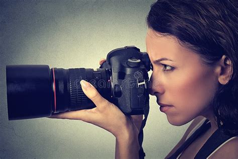 Side Profile Woman Taking Pictures With Professional Camera Studio