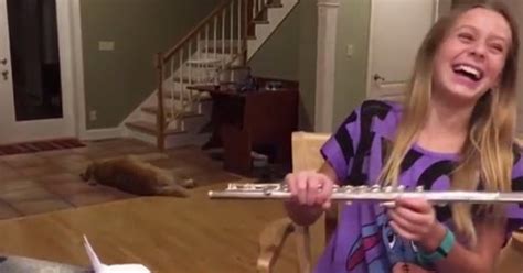 This Girl Tries To Practice Playing The Flute But The Dog Steals The