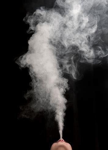 Female Blowing Vape Smoke Vapor Stock Photo - Download Image Now - iStock