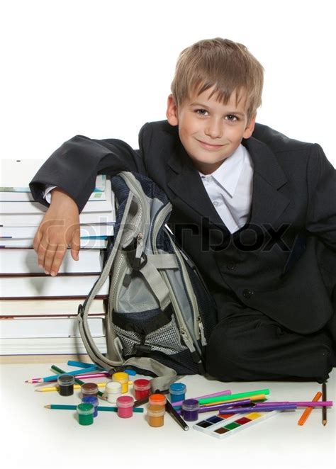 Boy Pencils Paints And Books Isolated On A White Background Stock