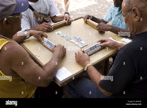 Old Men Playing Dominos On Street In Trinidad Cuba West Indies