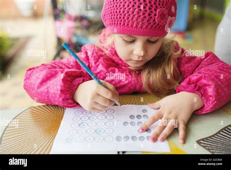 Little Blonde Girl Making Creative Exercise At Easter Stock Photo Alamy