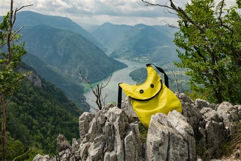 Smiling Emoji Backpack On Cliffs Stock Photos Motion Array