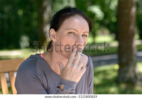 Portrait Mature Woman Smoking Cigarette Park Stock Photo 1121800829