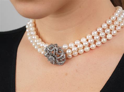 Cultured Pearl Three Strand Necklace With Large Diamond Set Flower