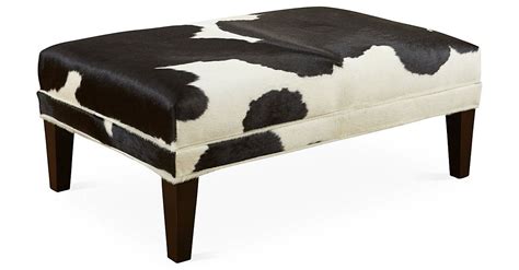 Upholstered In Black And White Cowhide This Handcrafted Ottoman Is