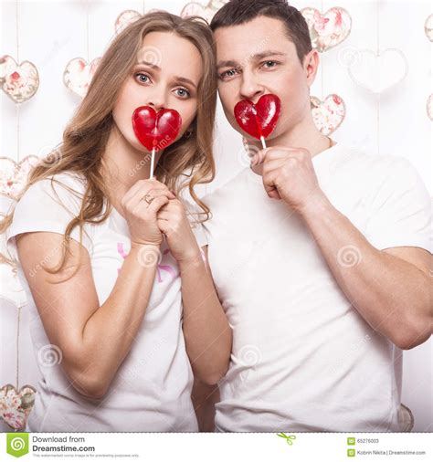 Young Beautiful Woman And Man In Love On Valentine S Day With Candy Laughing Happy Lovers