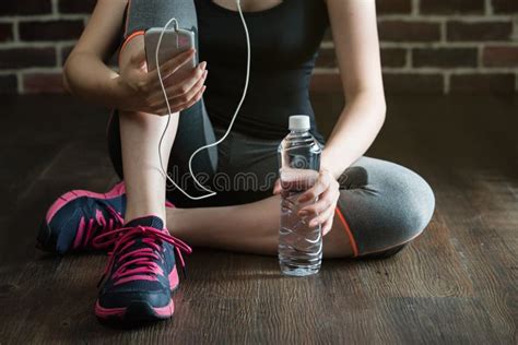 Take Rest Listening To Music Drinking Water After Fitness Exercise